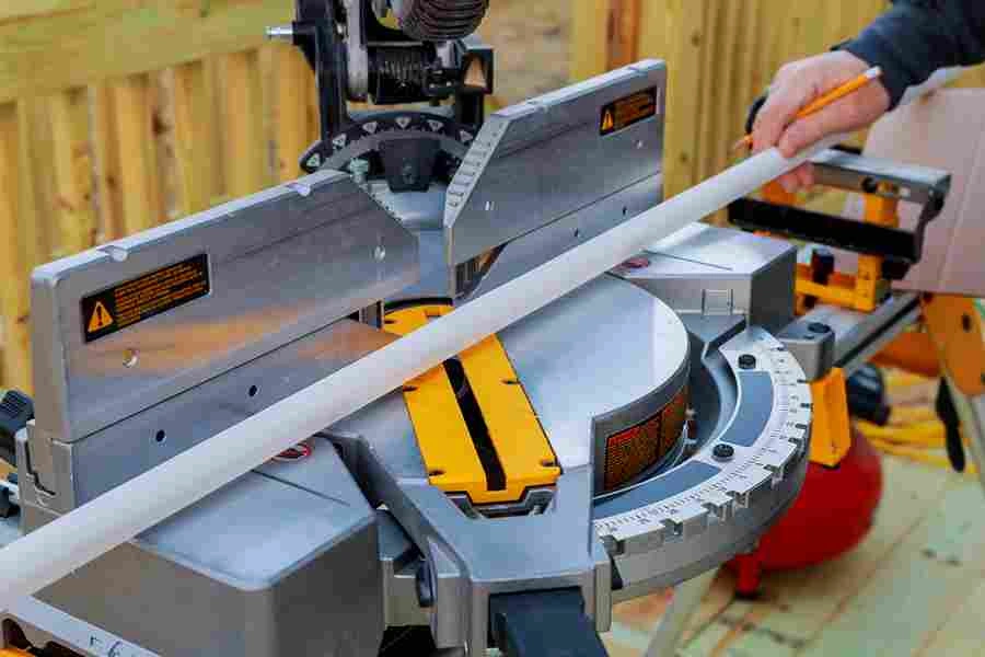 https://ukmech.uk/wp-content/uploads/2024/10/closeup-mature-man-sawing-lumber-with-sliding-compound-miter-saw-outdoors_11zon.webp